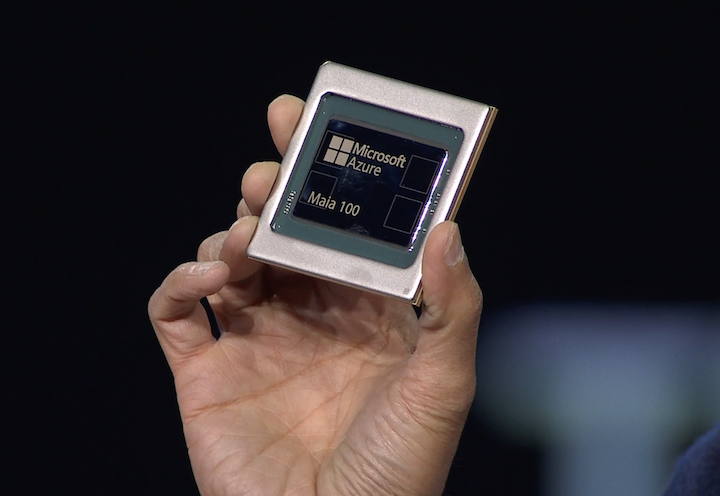 Microsoft CEO Satya Nadella shows the Azure Maia 100 chip at the Ignite 2023 event